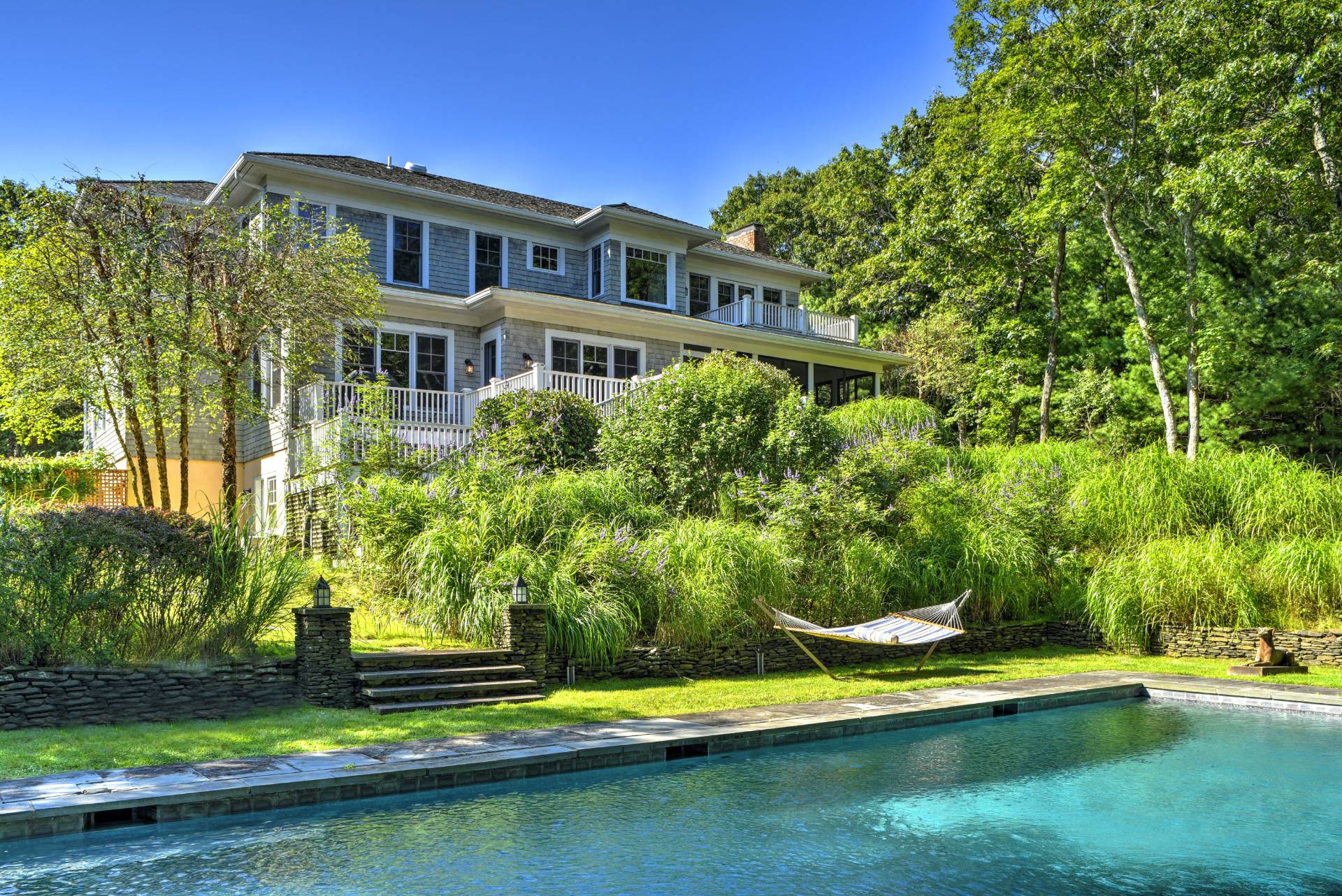 142 Bull Path East Hampton, NY 11937 - Photo 11 of 13 a front view of a house with a yard
