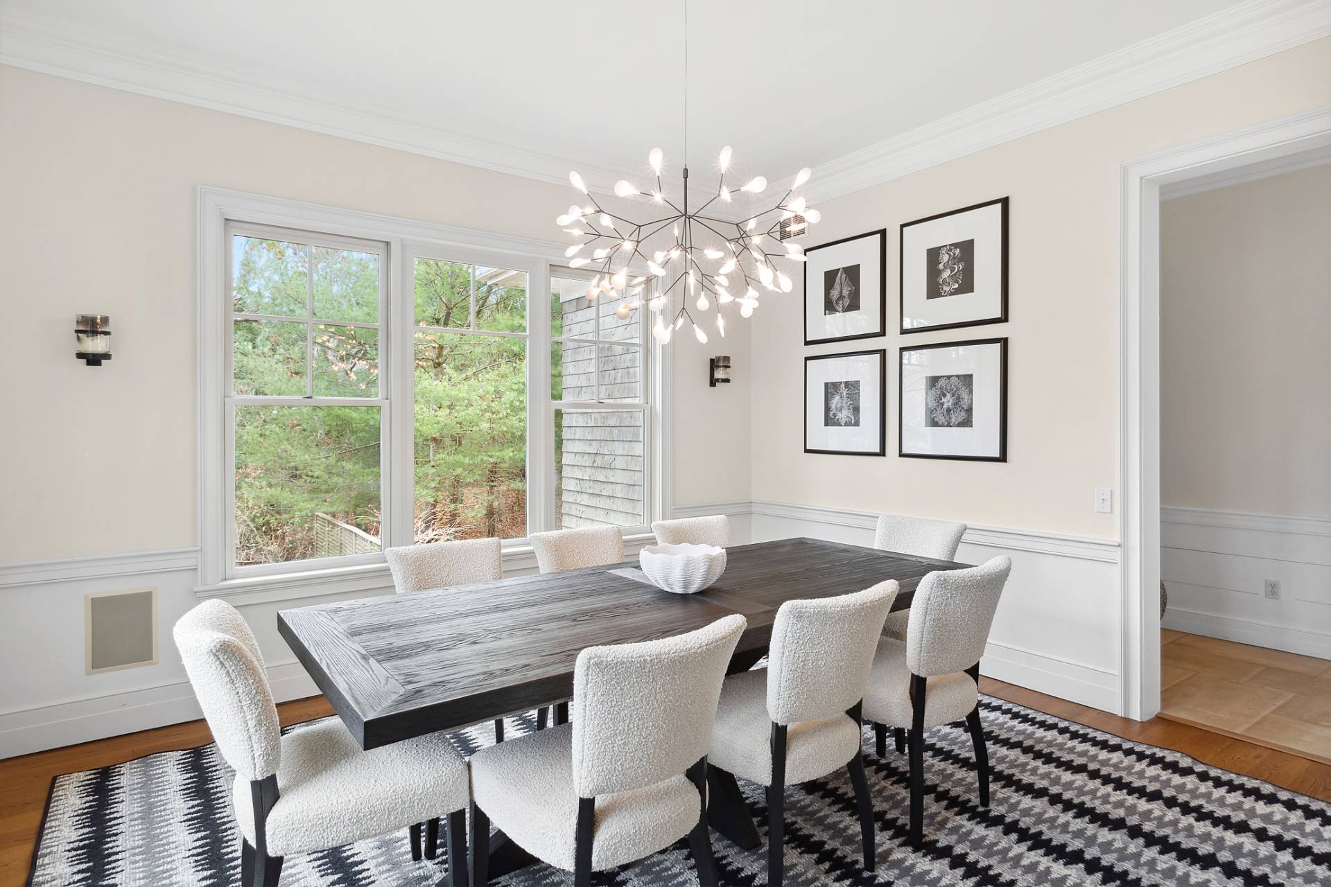 142 Bull Path East Hampton, NY 11937 - Photo 2 of 13 a view of a dining room with furniture a chandelier and wooden floor