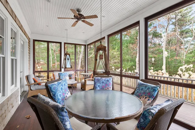 a dining room with furniture window and outside view