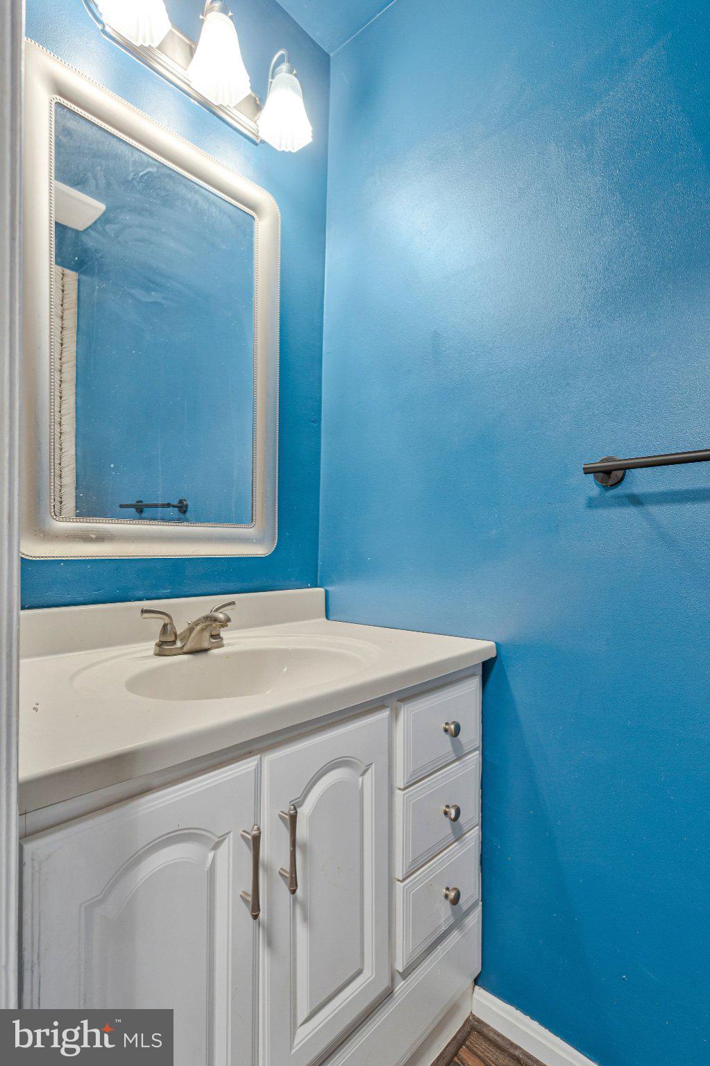 1675 Ridgely Court, Unit 182 Crofton, MD 21114 - Photo 18 of 47 a bathroom with a sink and a mirror