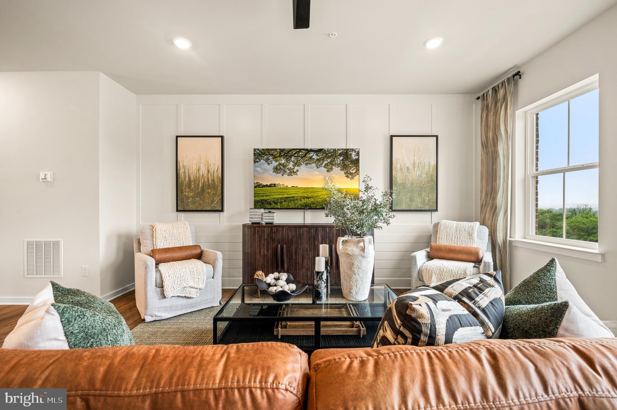 206 Bronze Street Phoenixville, PA 19460 - Photo 12 of 31 a living room with furniture and a flat screen tv
