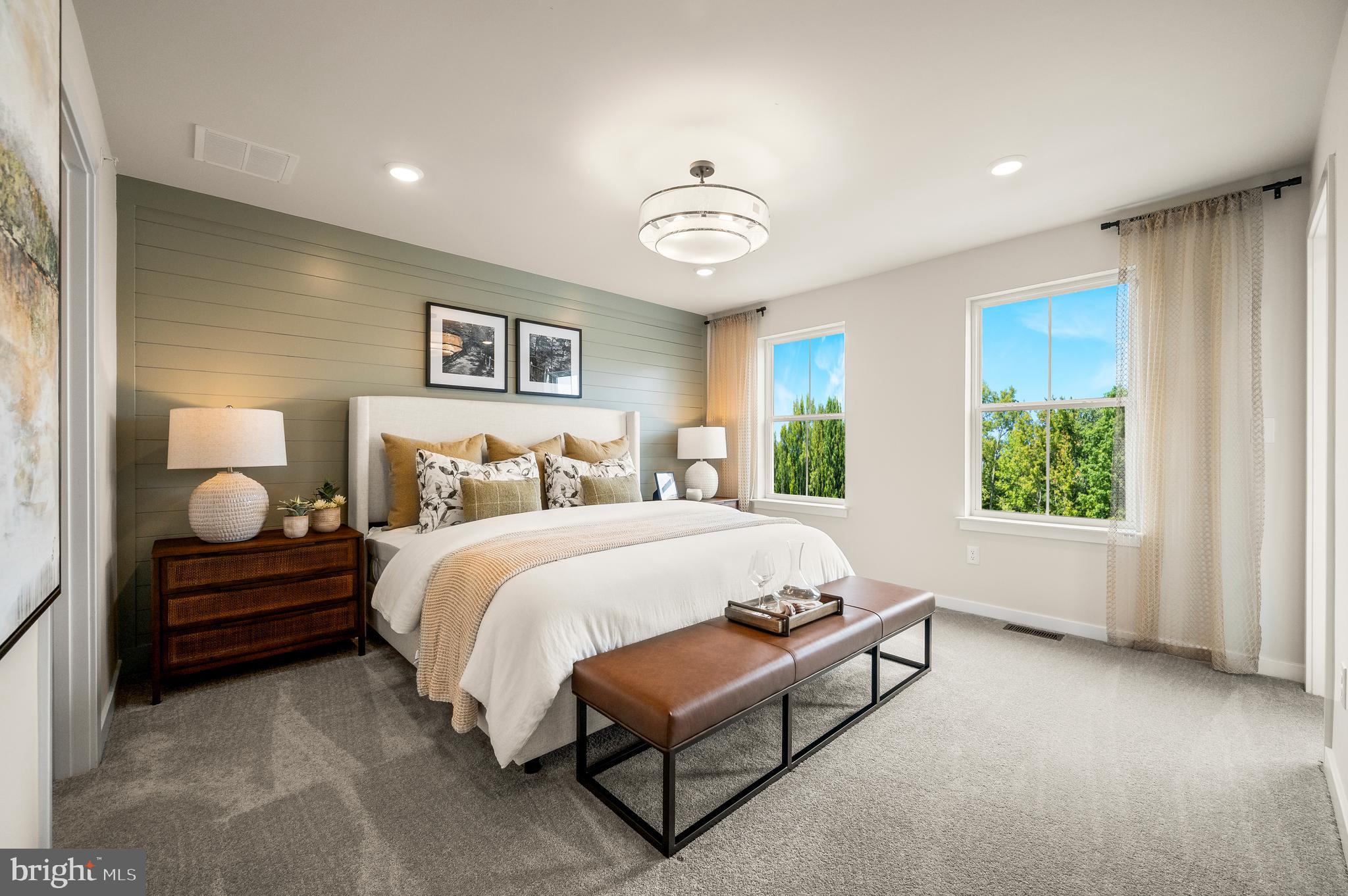206 Bronze Street Phoenixville, PA 19460 - Photo 15 of 31 a spacious bedroom with a bed and a large window