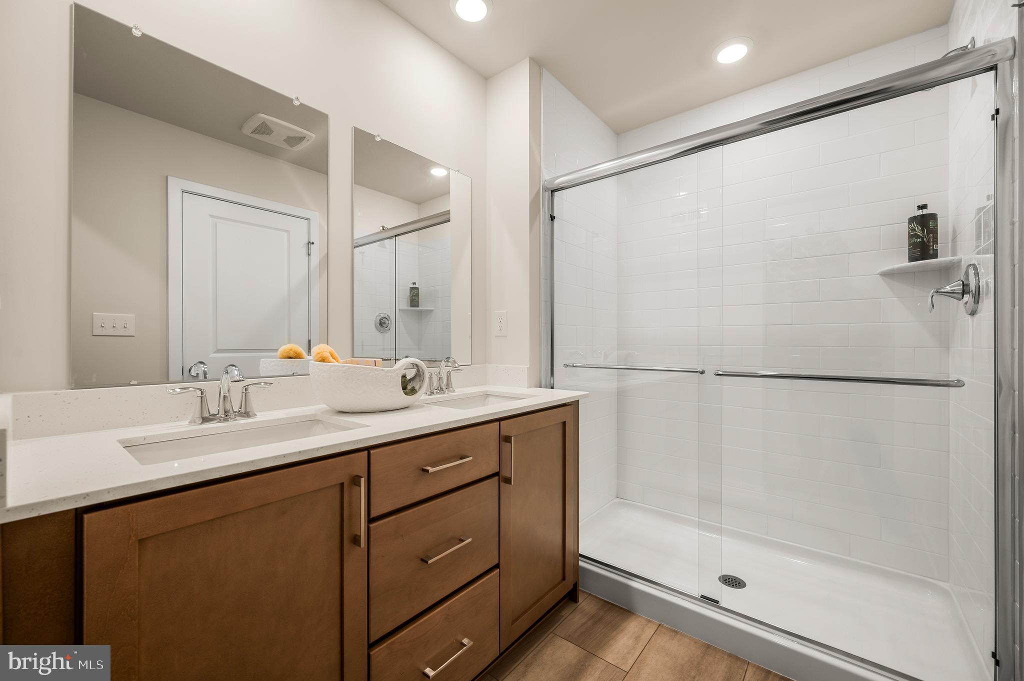 206 Bronze Street Phoenixville, PA 19460 - Photo 17 of 31 a bathroom with a double vanity sink mirror and shower