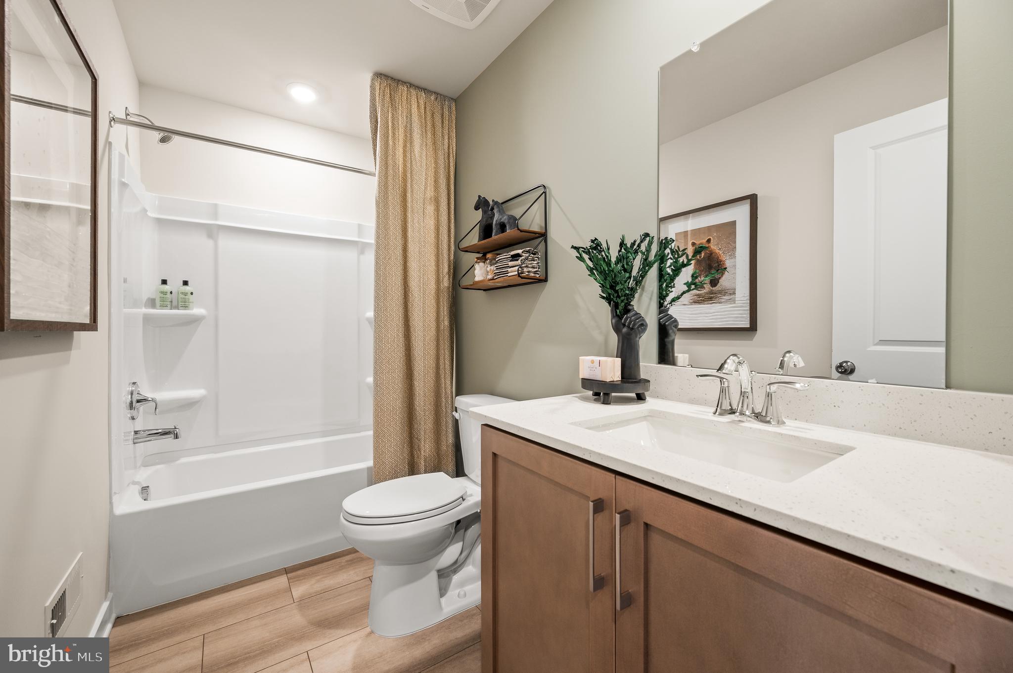 206 Bronze Street Phoenixville, PA 19460 - Photo 19 of 31 a bathroom with a sink a toilet and shower