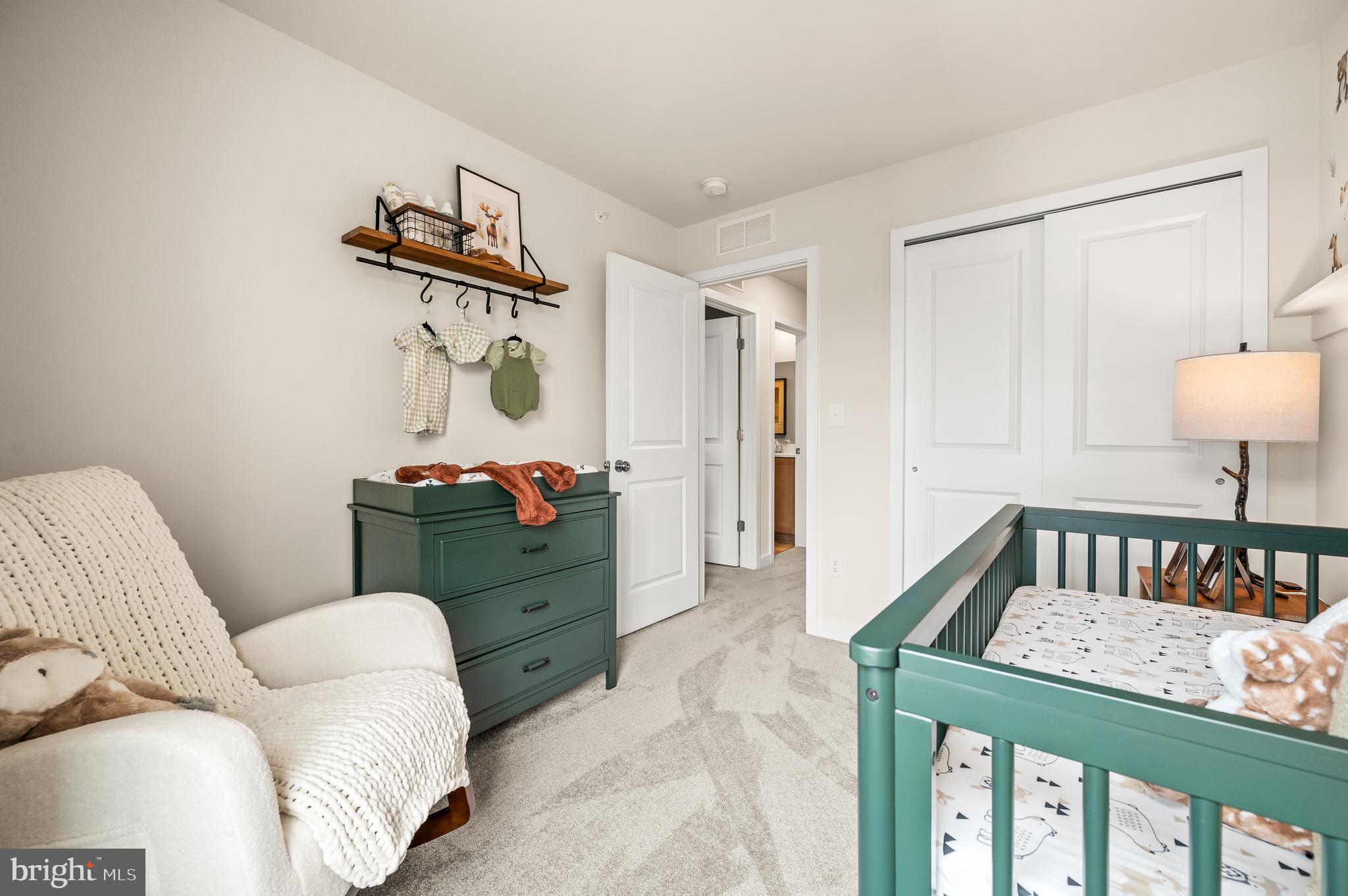 206 Bronze Street Phoenixville, PA 19460 - Photo 21 of 31 a bedroom with a bed and a mirror