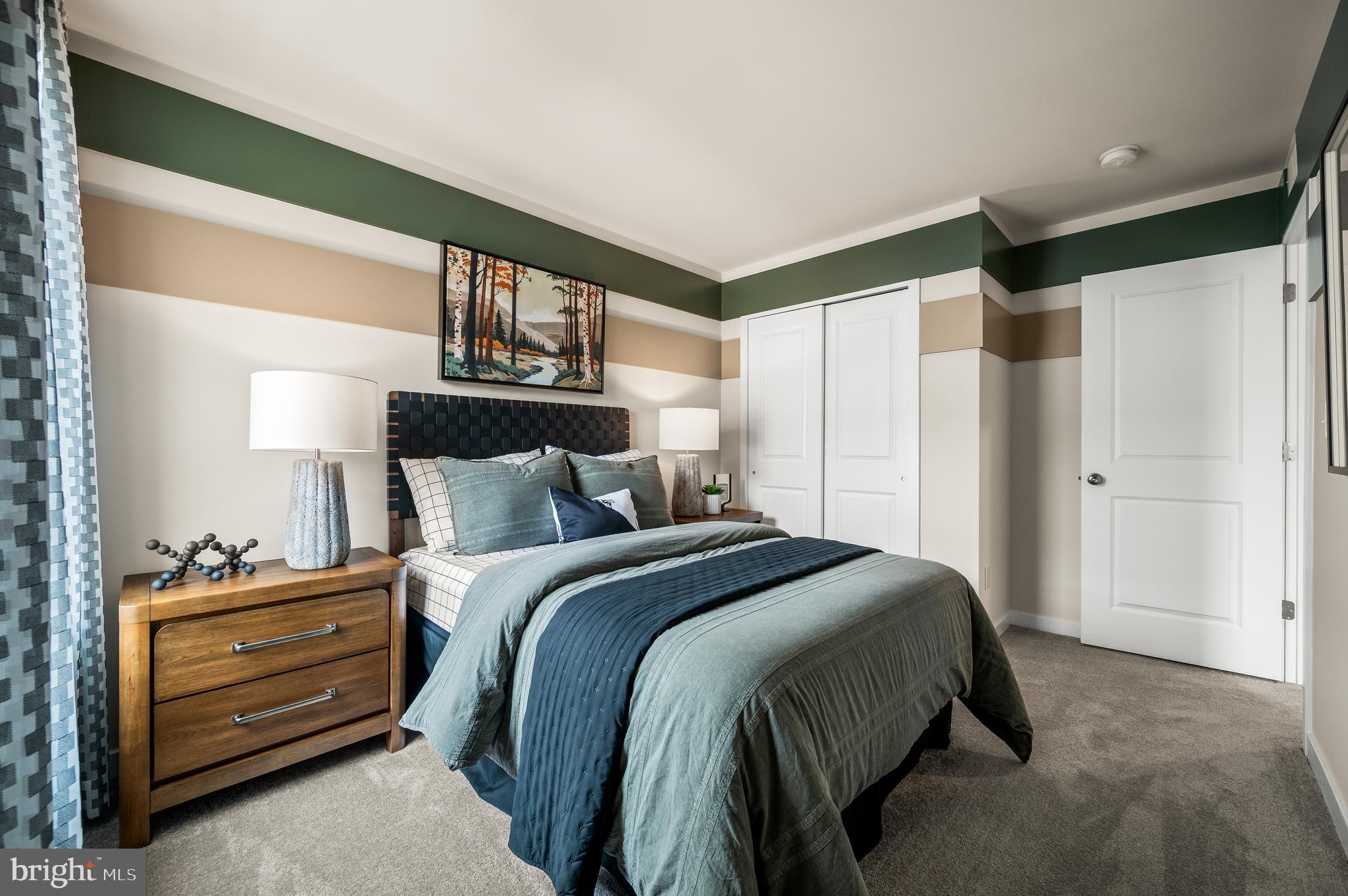 206 Bronze Street Phoenixville, PA 19460 - Photo 22 of 31 a bedroom with a bed and a cabinets