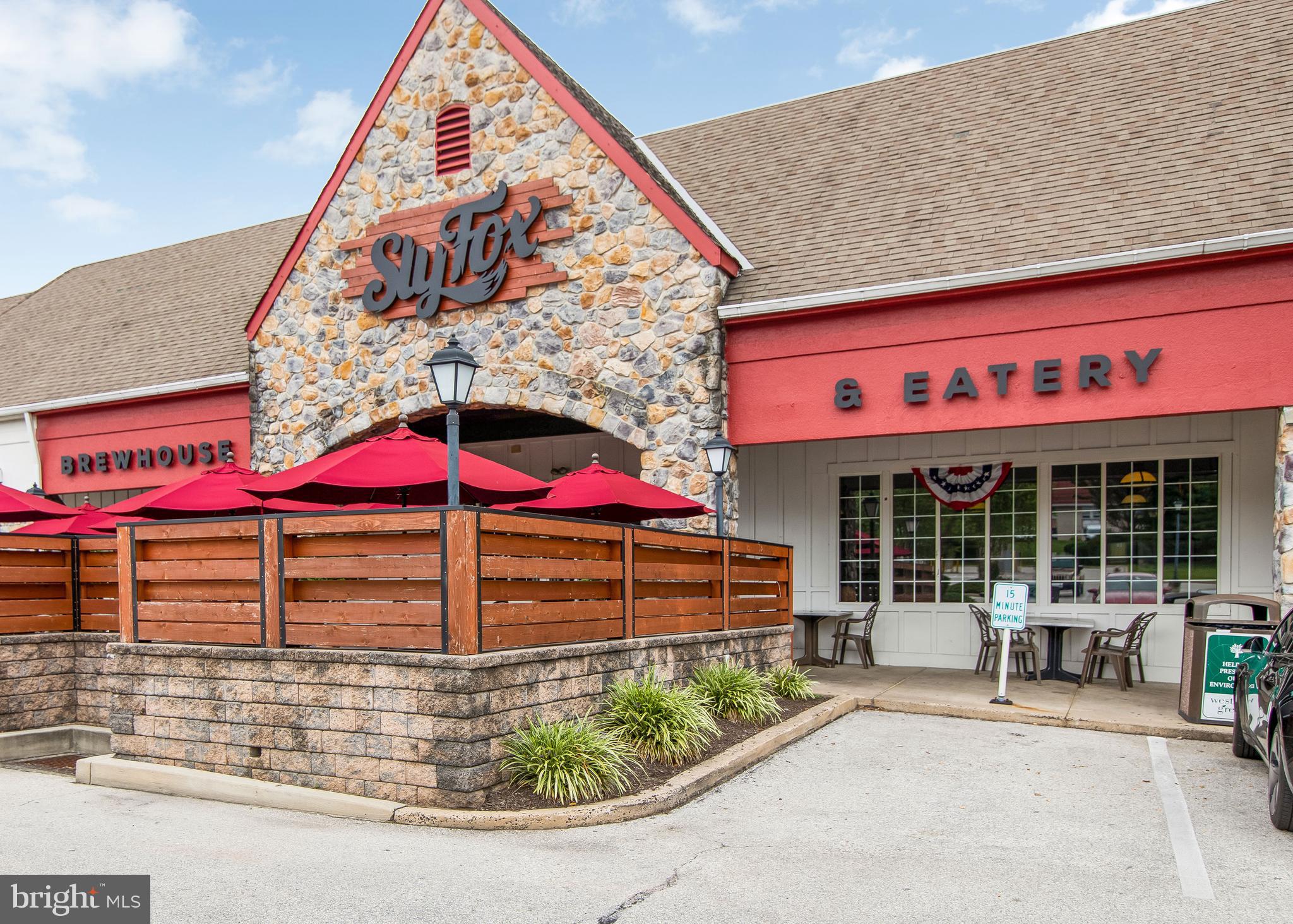 206 Bronze Street Phoenixville, PA 19460 - Photo 31 of 31 an outdoor cafe with a table and chairs under an umbrella
