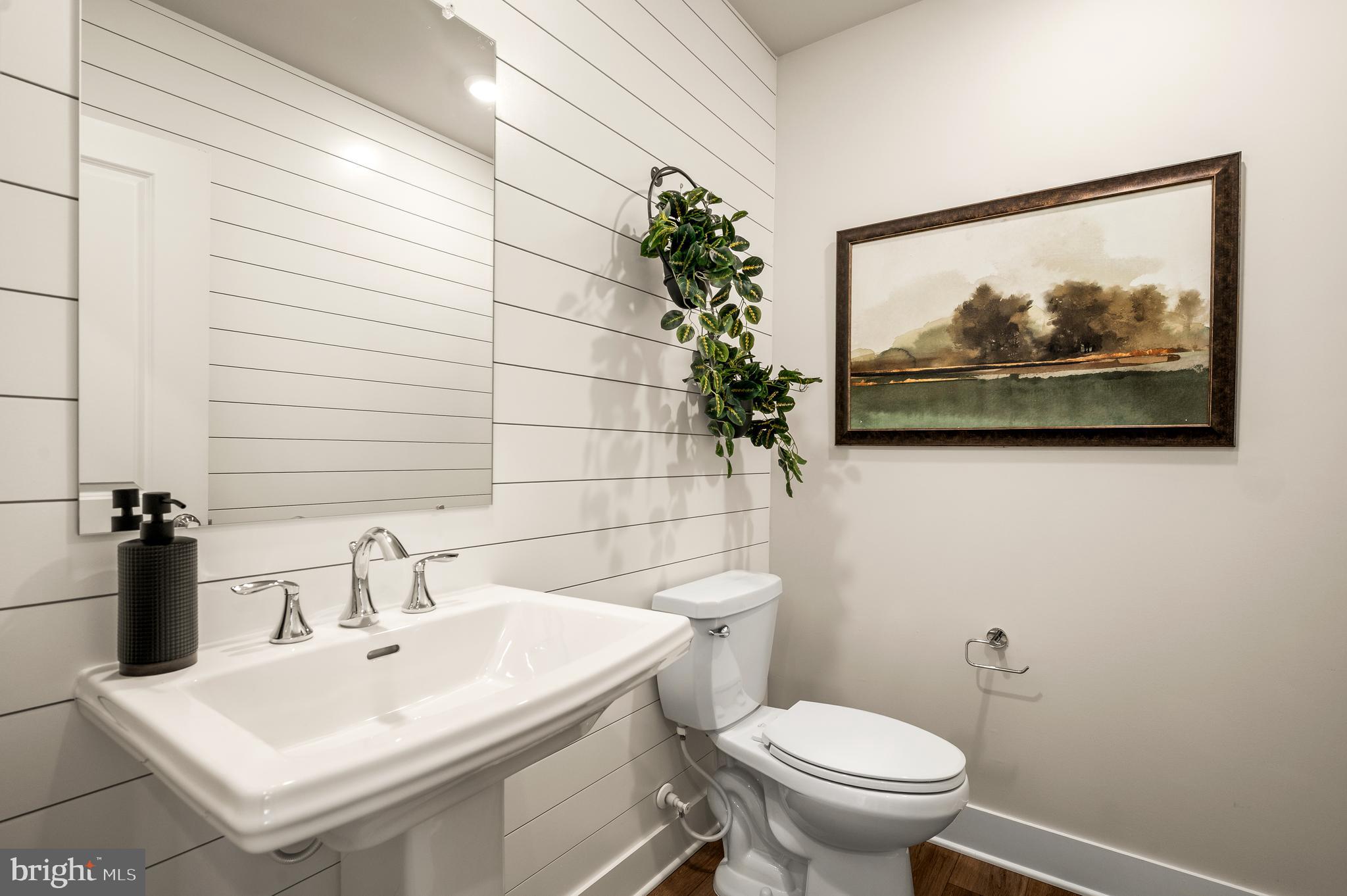 206 Bronze Street Phoenixville, PA 19460 - Photo 5 of 31 a bathroom with a sink mirror and toilet