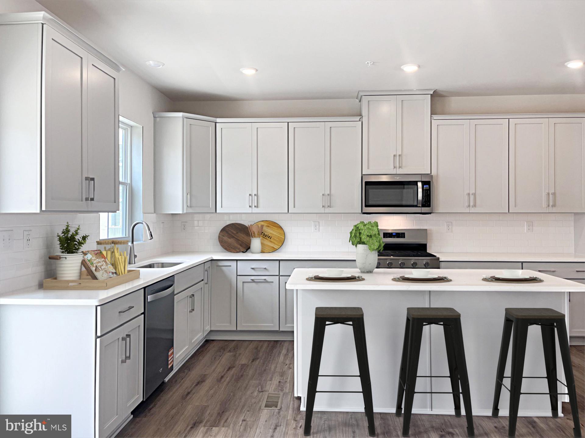 206 Bronze Street Phoenixville, PA 19460 - Photo 6 of 31 a kitchen with appliances cabinets and a sink
