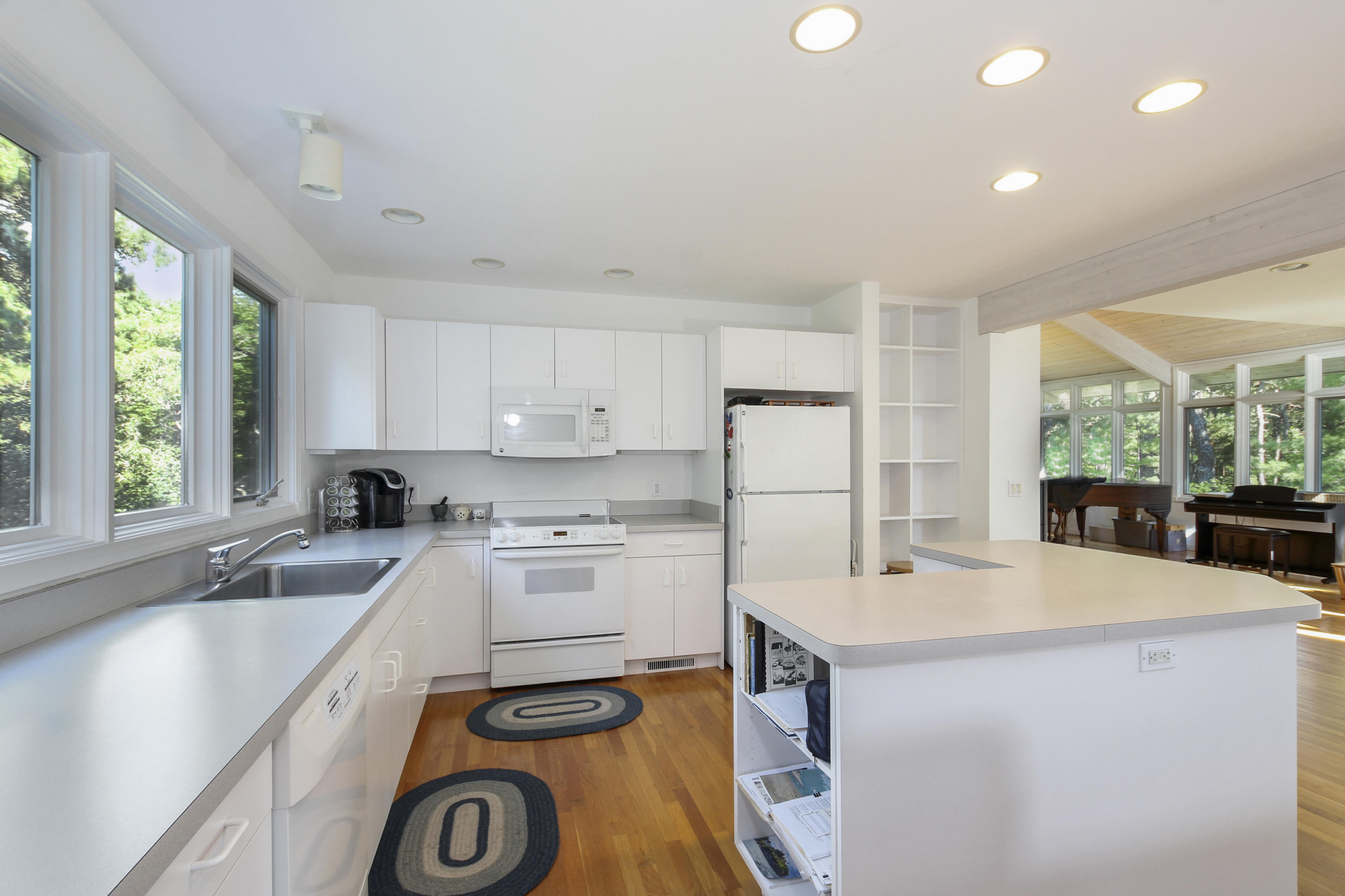 164 Long Pond Road Wellfleet, MA 02667 - Photo 13 of 33 a kitchen with a sink a stove and cabinets