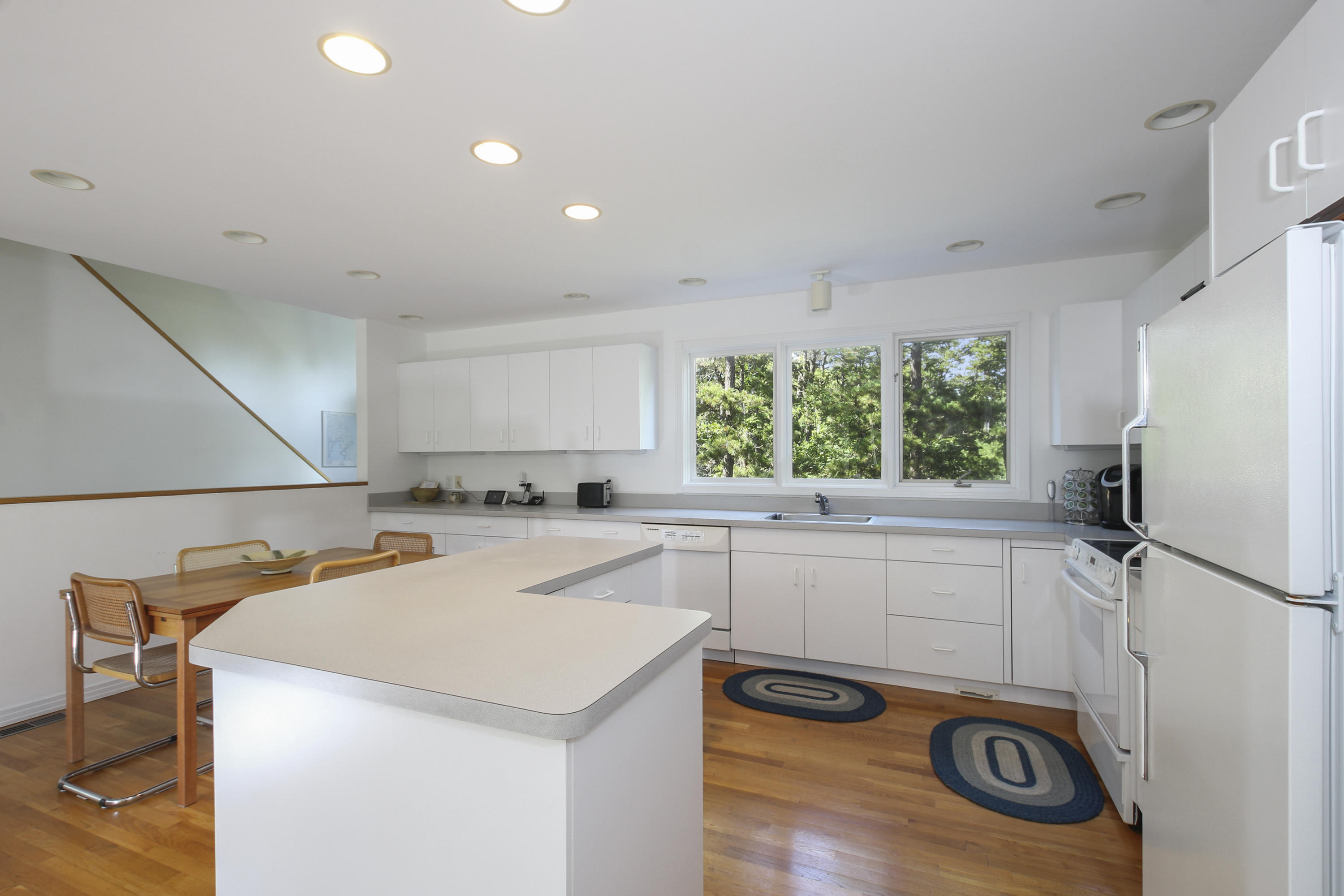 164 Long Pond Road Wellfleet, MA 02667 - Photo 14 of 33 a kitchen that has a sink and a stove in it