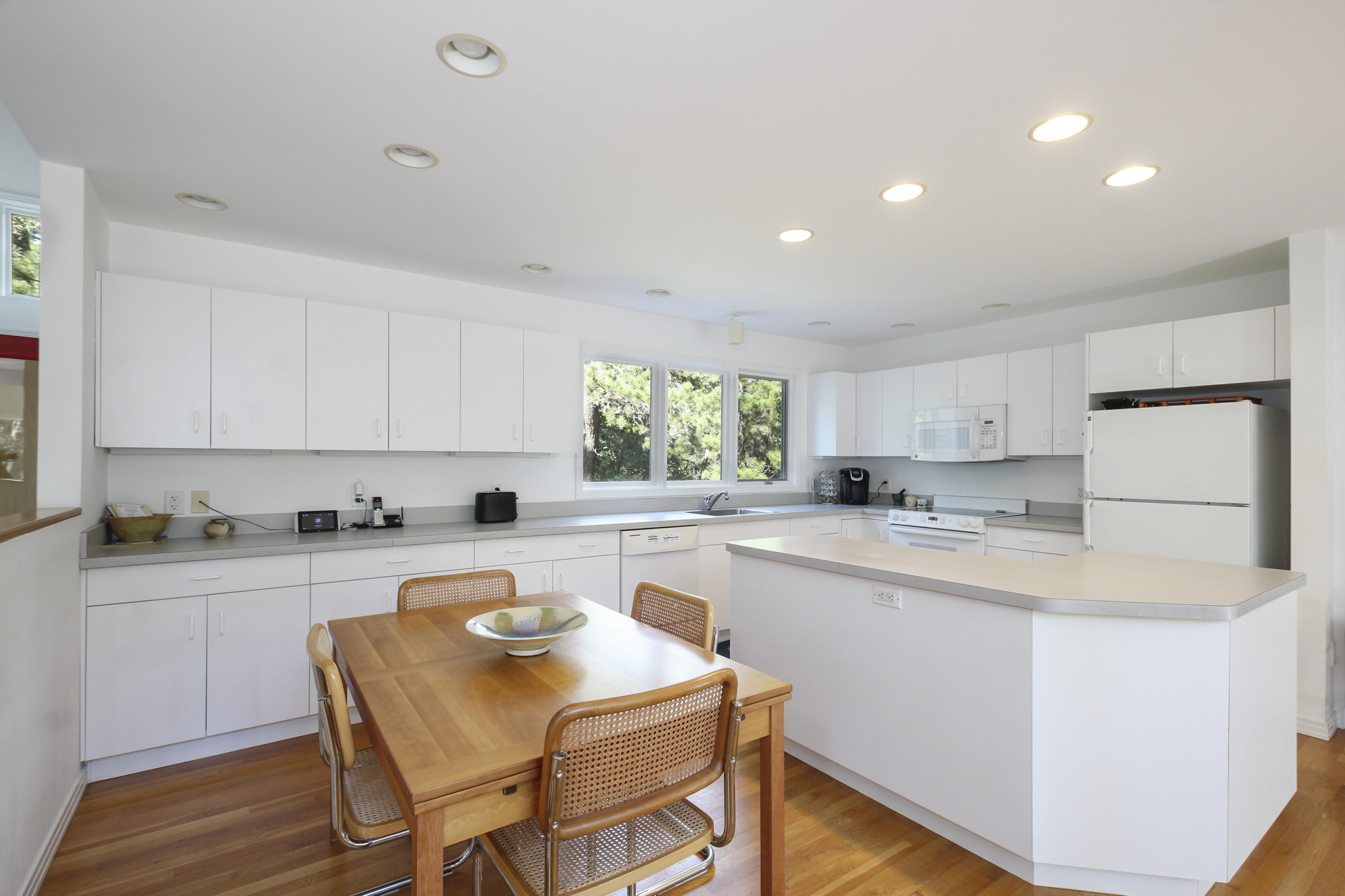 164 Long Pond Road Wellfleet, MA 02667 - Photo 15 of 33 a kitchen with a stove a sink and a refrigerator