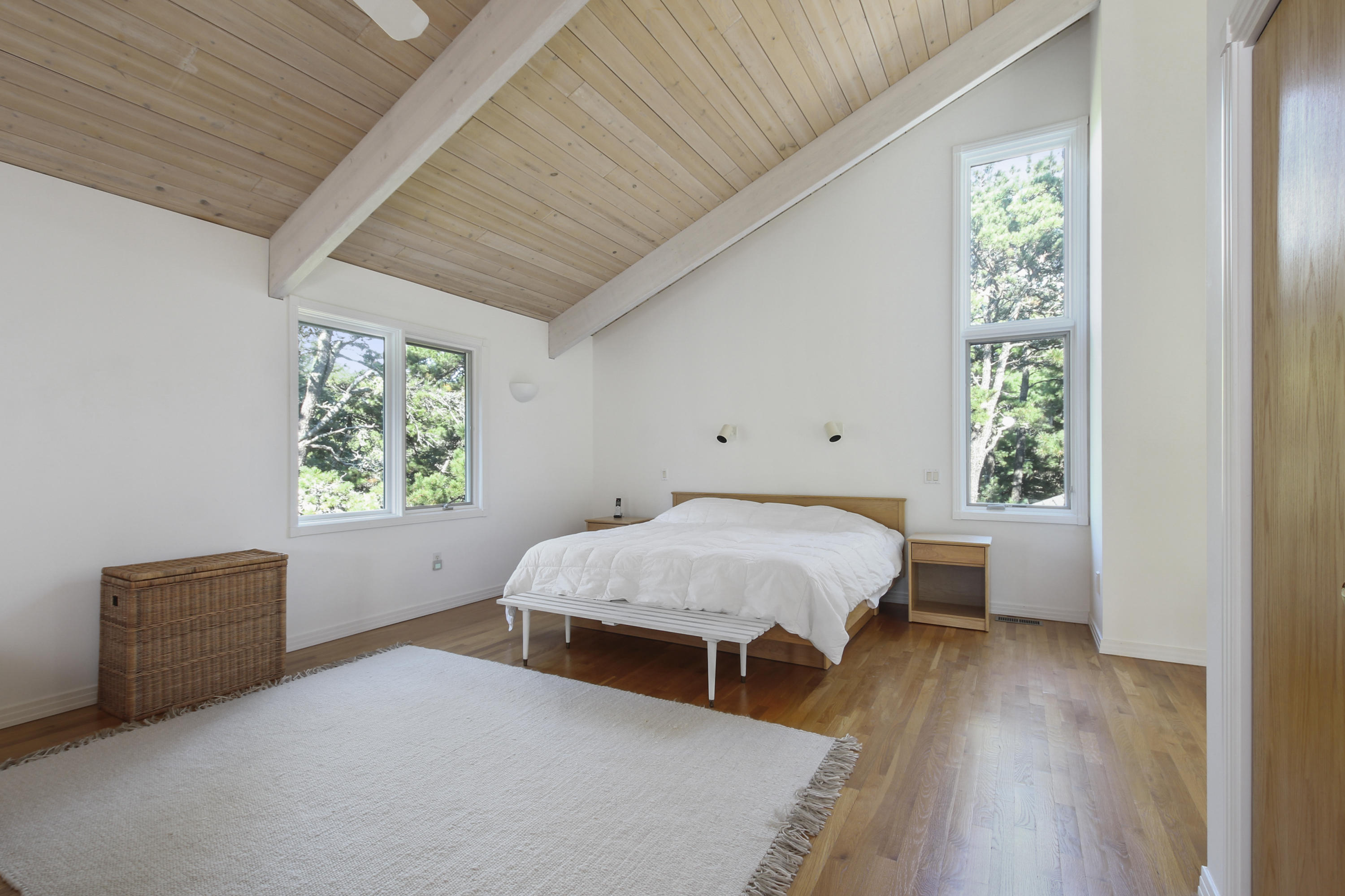 164 Long Pond Road Wellfleet, MA 02667 - Photo 20 of 33 a spacious bedroom with a bed and a window