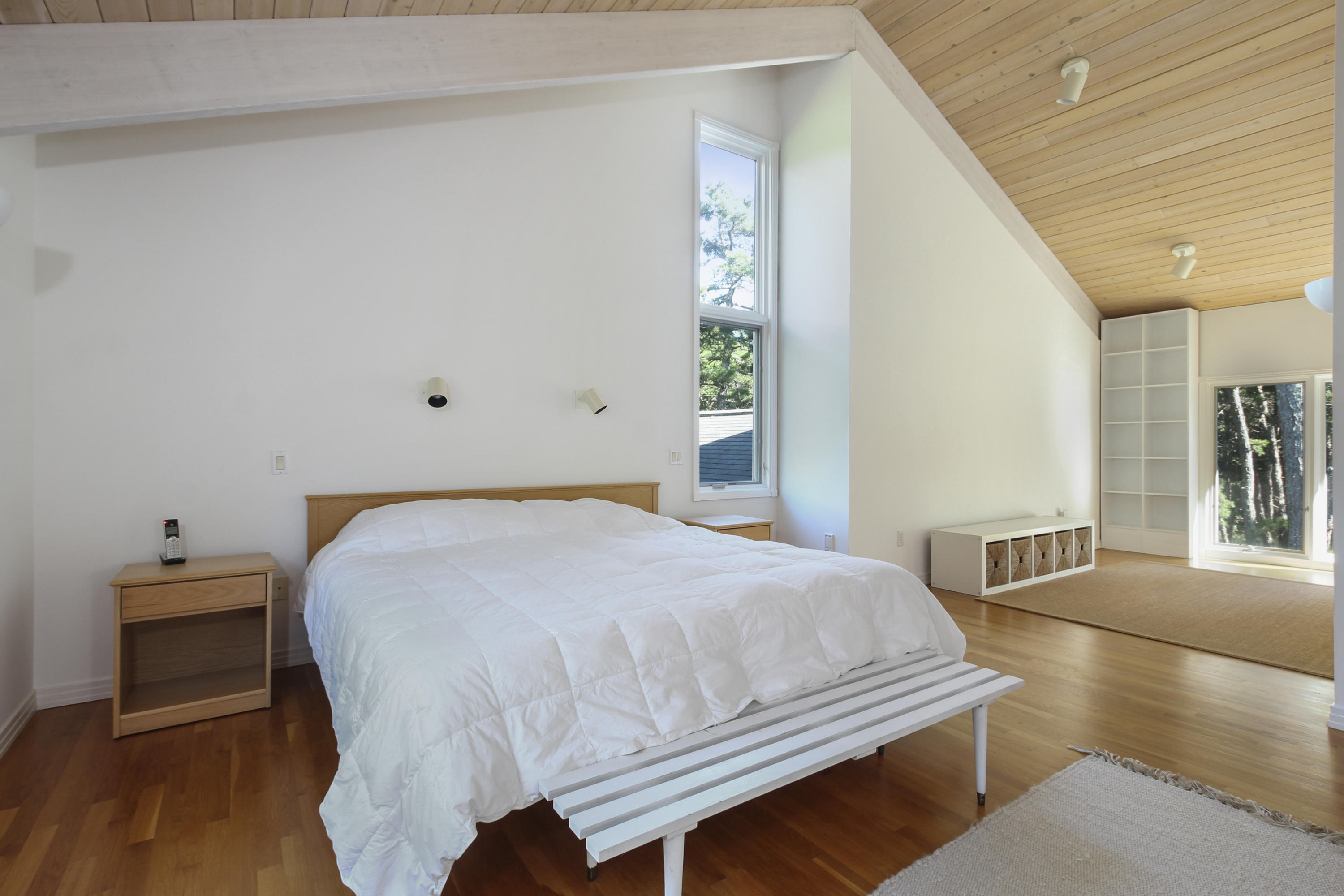 164 Long Pond Road Wellfleet, MA 02667 - Photo 21 of 33 a bedroom with a bed and wooden floor