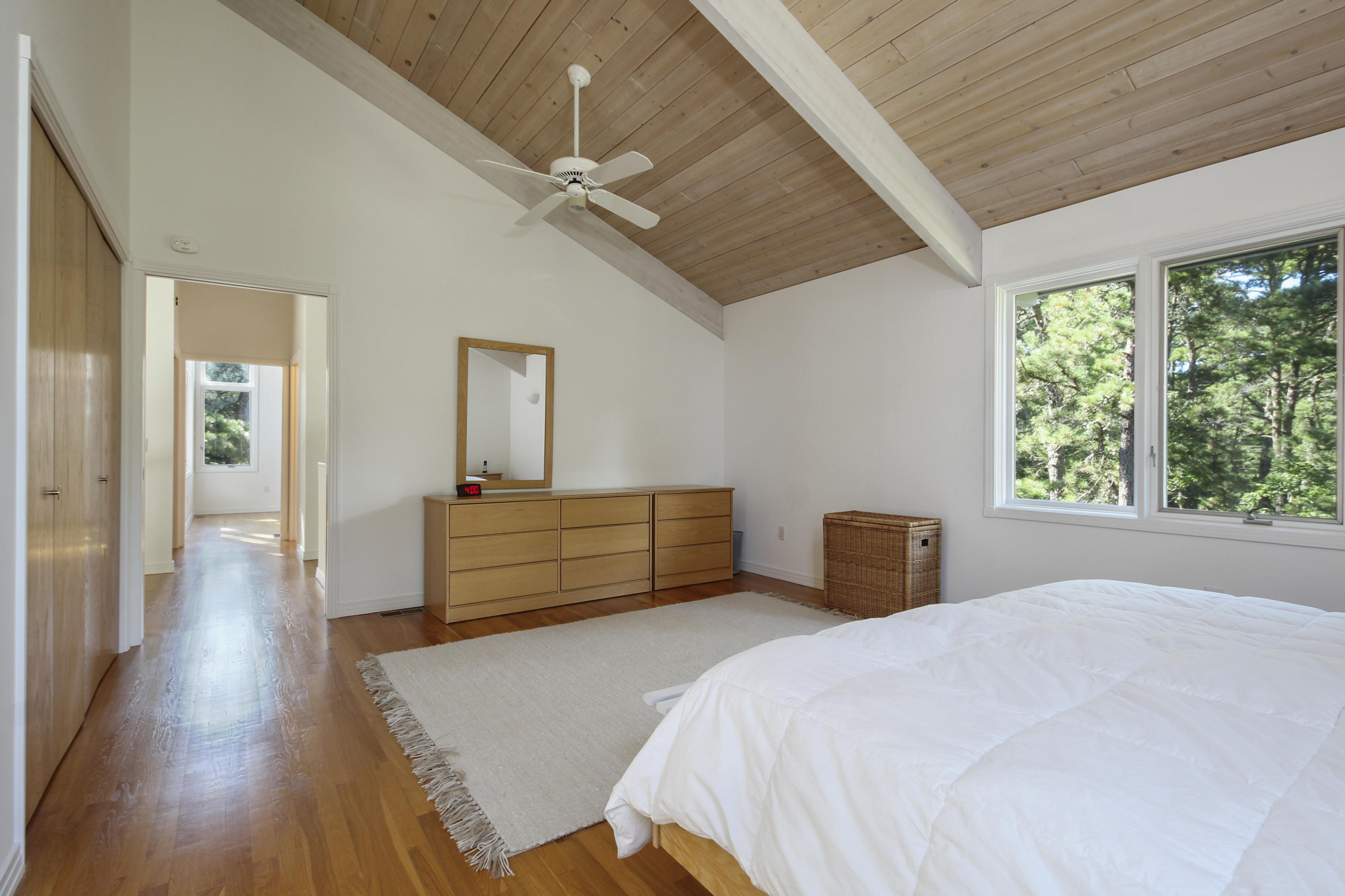 164 Long Pond Road Wellfleet, MA 02667 - Photo 22 of 33 a bedroom with a bed and a dresser