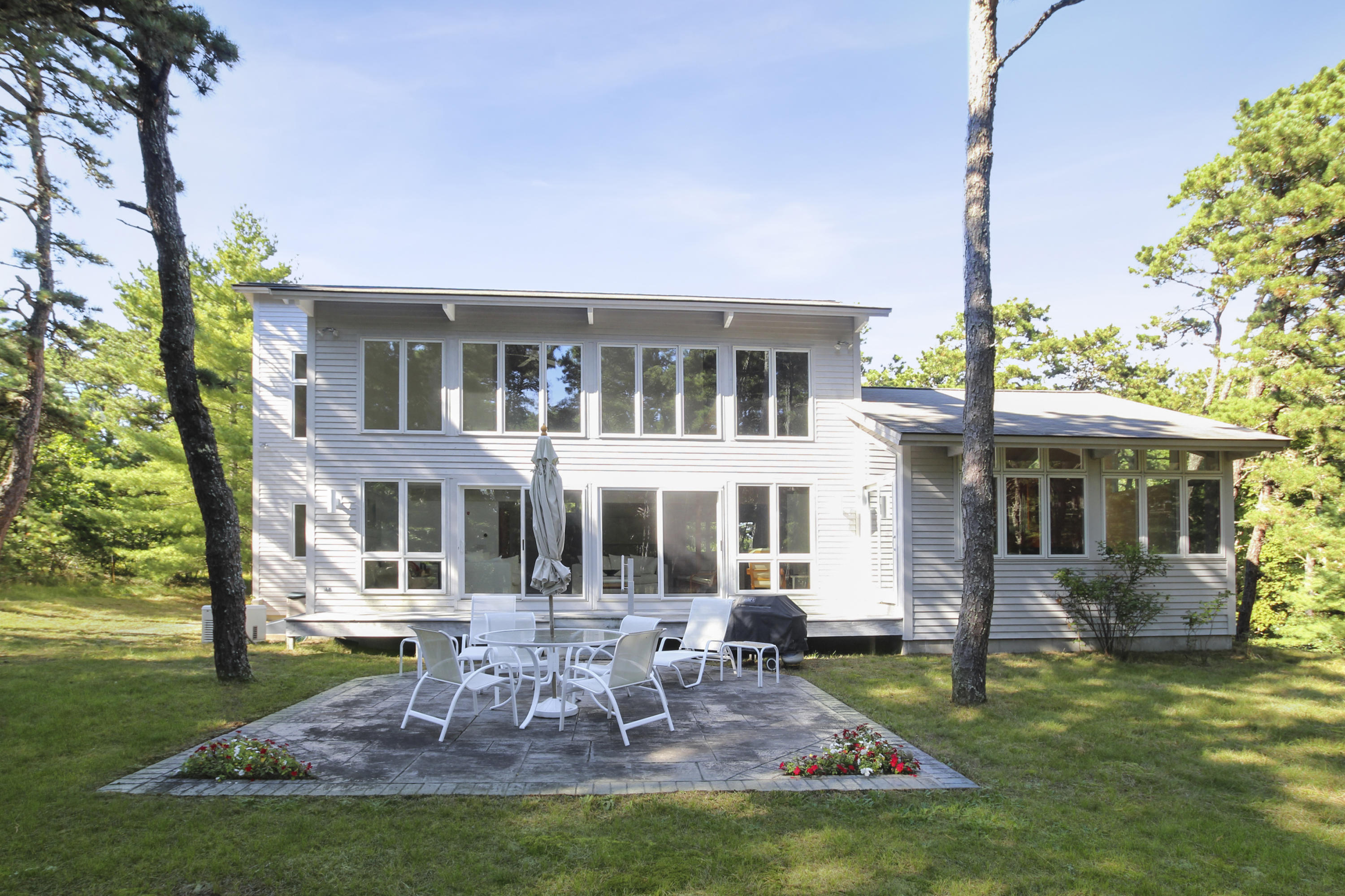 164 Long Pond Road Wellfleet, MA 02667 - Photo 29 of 33 a view of a house with a yard porch and sitting area