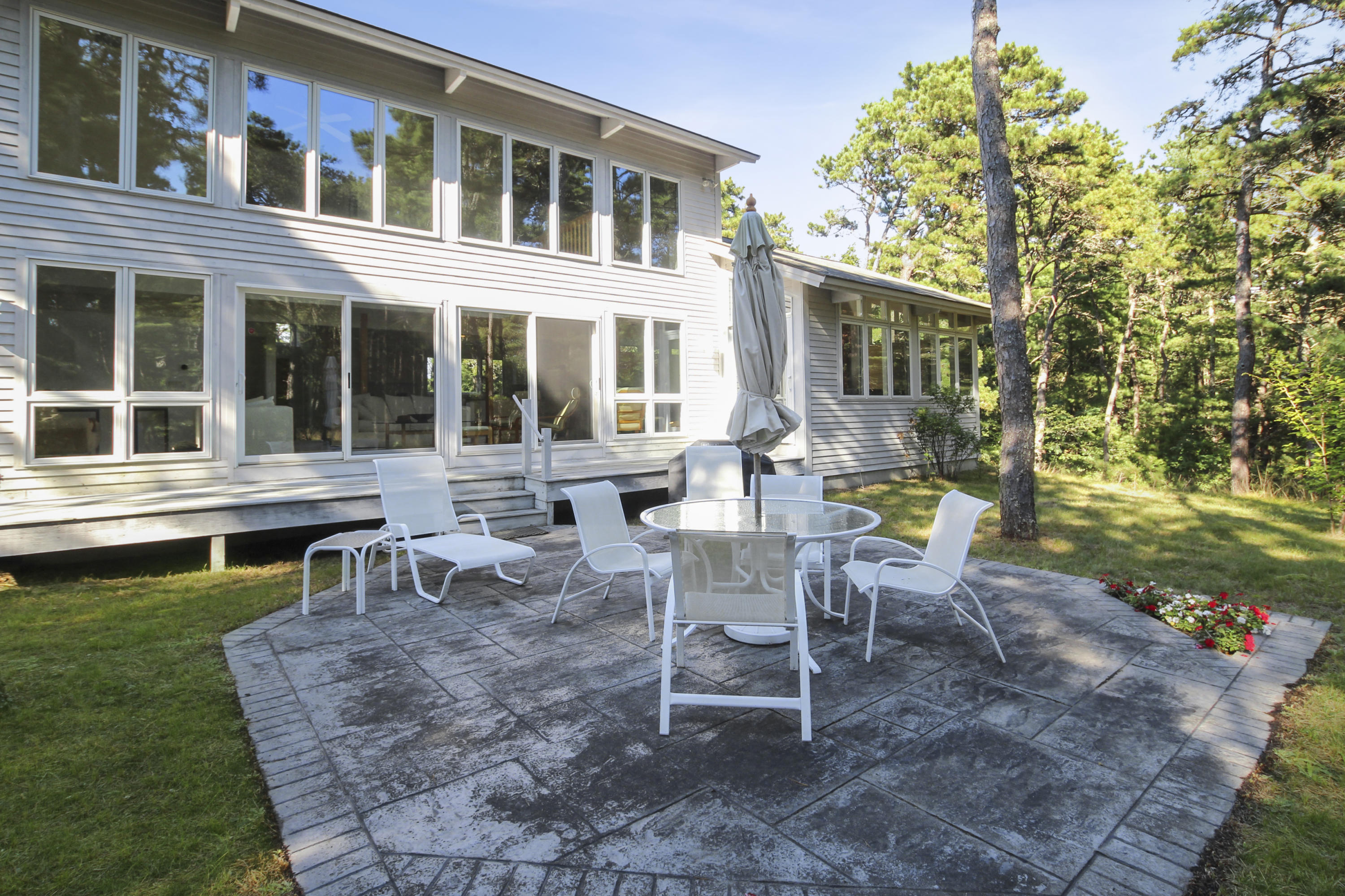 164 Long Pond Road Wellfleet, MA 02667 - Photo 30 of 33 a view of a house with backyard sitting area and garden