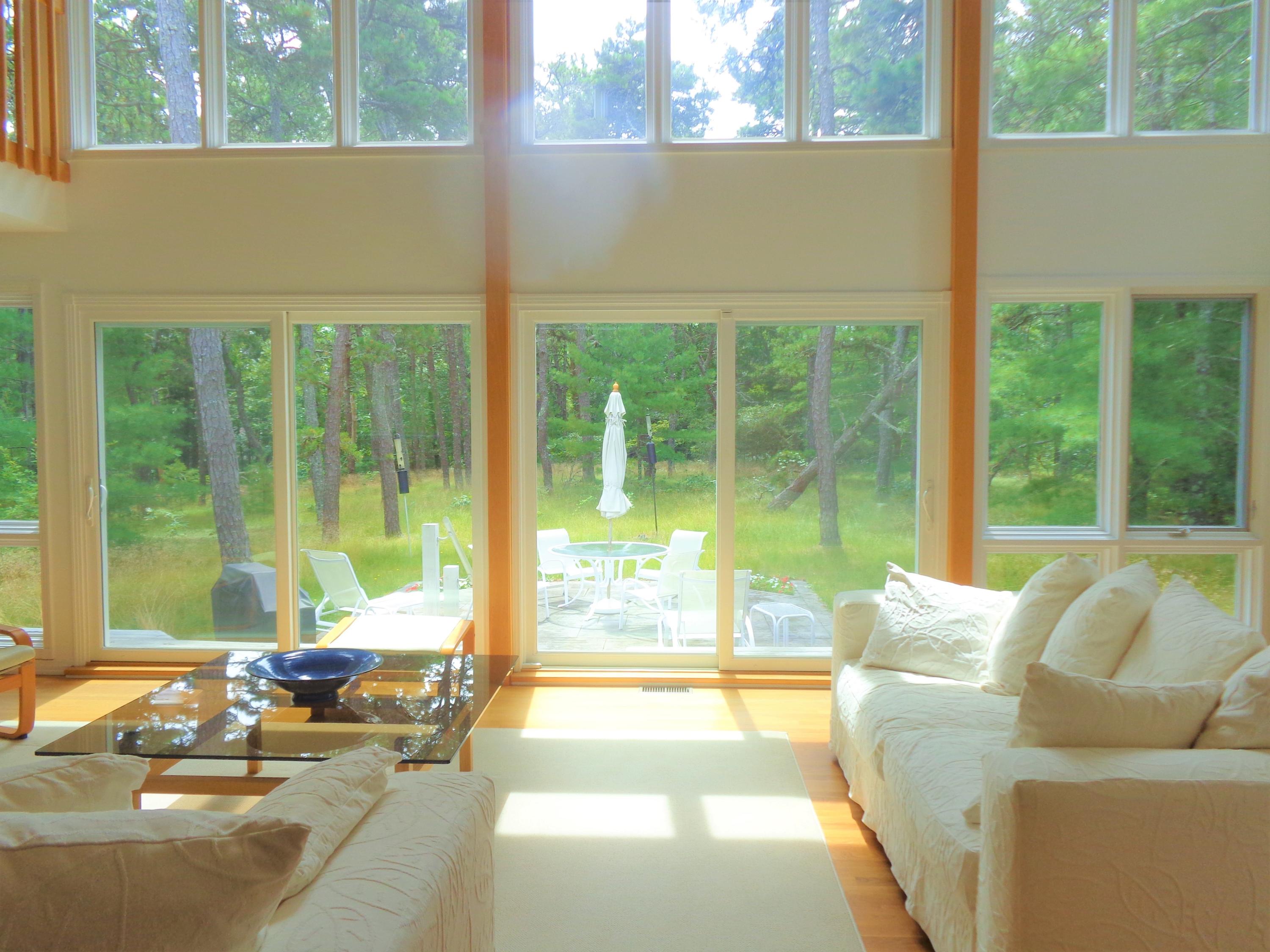 164 Long Pond Road Wellfleet, MA 02667 - Photo 6 of 33 a living room with a large window couches and deck