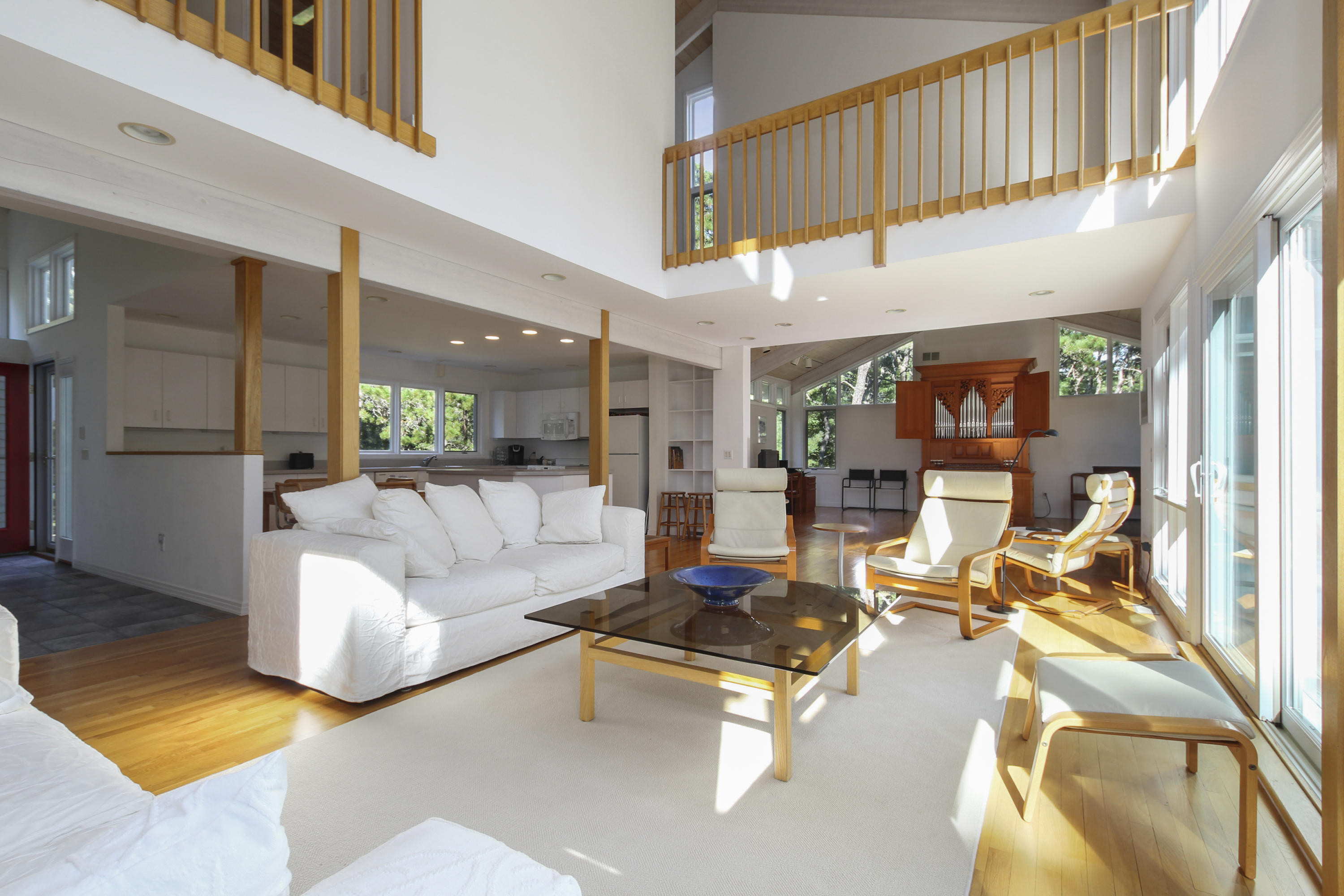 164 Long Pond Road Wellfleet, MA 02667 - Photo 8 of 33 a living room with furniture fireplace and a table