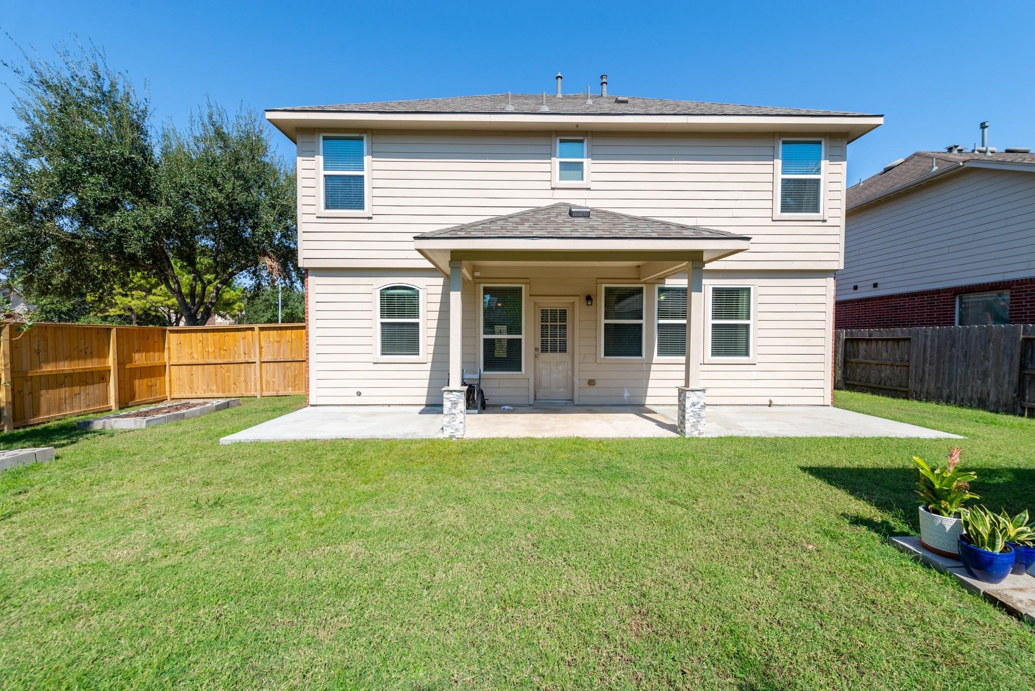6402 Addlestone Ridge Lane Katy, TX 77494 - Photo 24 of 25 Enjoy outdoor living on the covered back patio overlooking the spacious fenced backyard. Raised garden beds provide the perfect place to grow your own vegetables, herbs, or seasonal flowers.