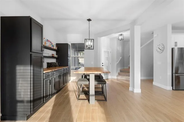 a kitchen with kitchen island a counter top space stainless steel appliances and cabinets