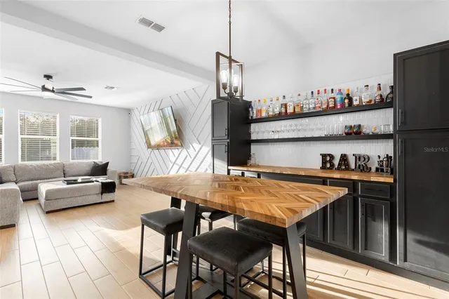 a view of a dining room with furniture and window