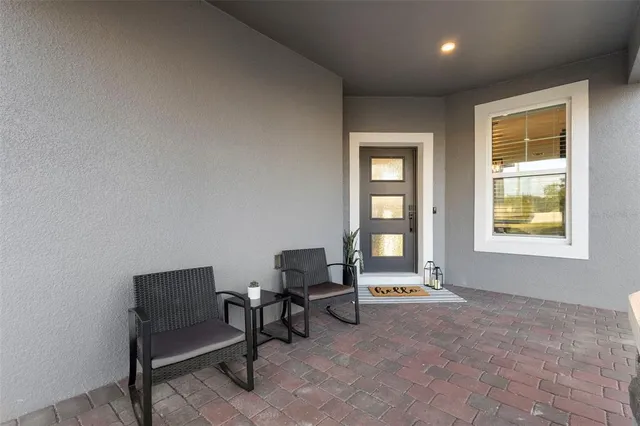 a living room with furniture and a window