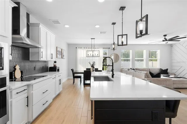 a large white kitchen with lots of counter space