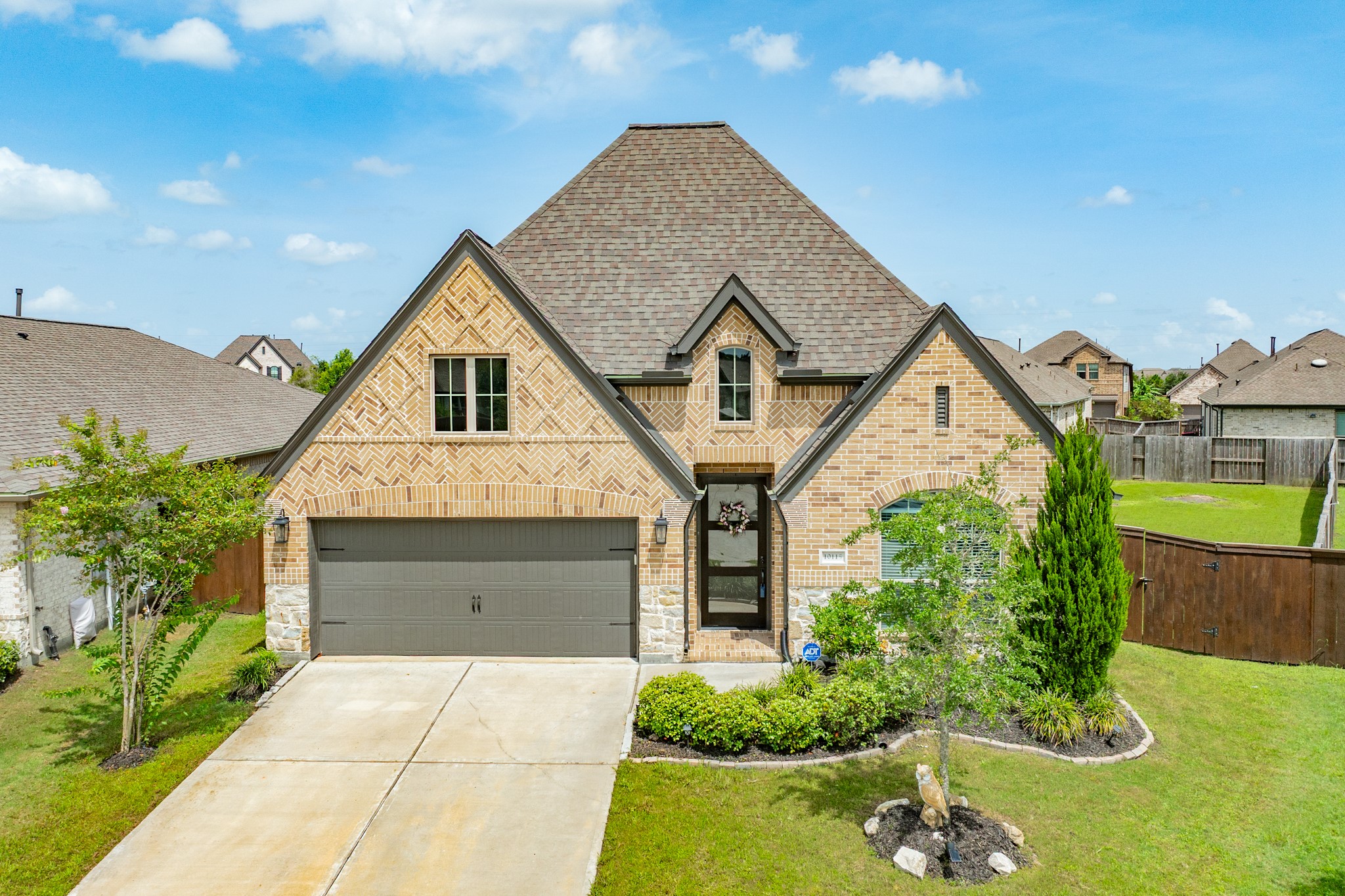 10115 Stride Court Rosharon, TX 77583 - Photo 32 of 40 This beautiful all-brick and stone Perry home is situated at the end of a quiet cul-de-sac. The property boasts exceptional curb appeal, featuring professional landscaping that perfectly complements the home's striking exterior architecture.