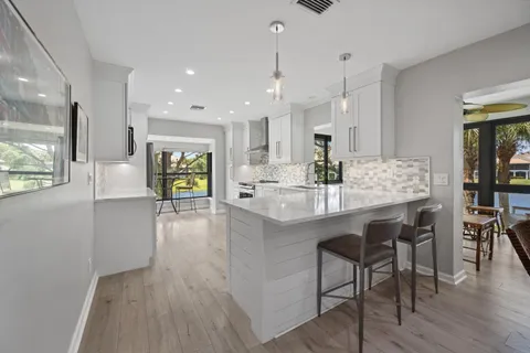 a kitchen with a table and chairs in it