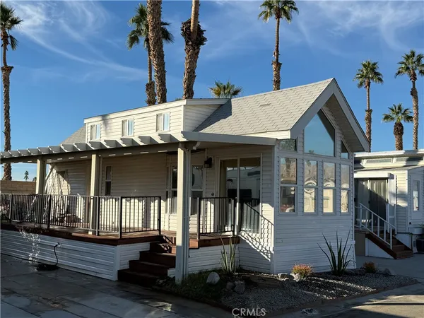 a front view of a house with a porch