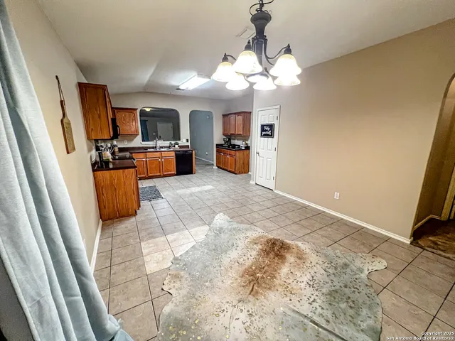 a view of a livingroom with furniture and a flat screen tv