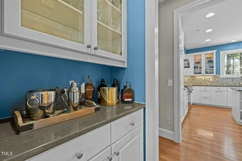 a kitchen with sink and cabinets