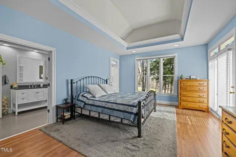 a bedroom with furniture and a window