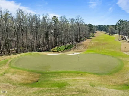 a view of swimming pool with an outdoor space and seating area