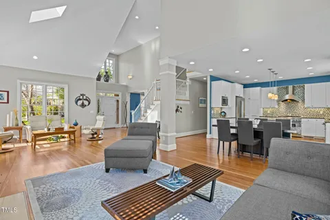 a living room with lots of furniture and a rug