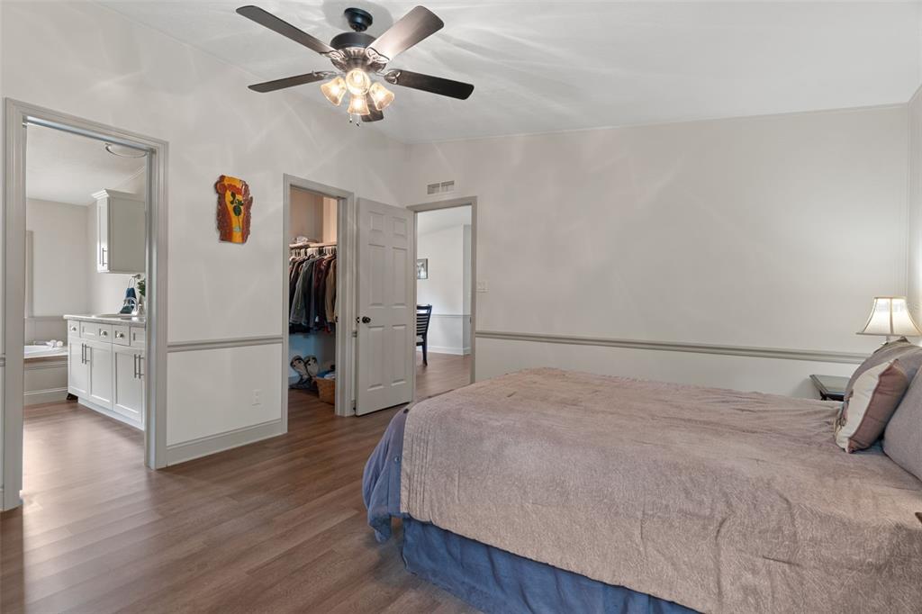 26255 Lambeth Road Brooksville, FL 34601 - Photo 40 of 76 a bedroom with a bed and a ceiling fan