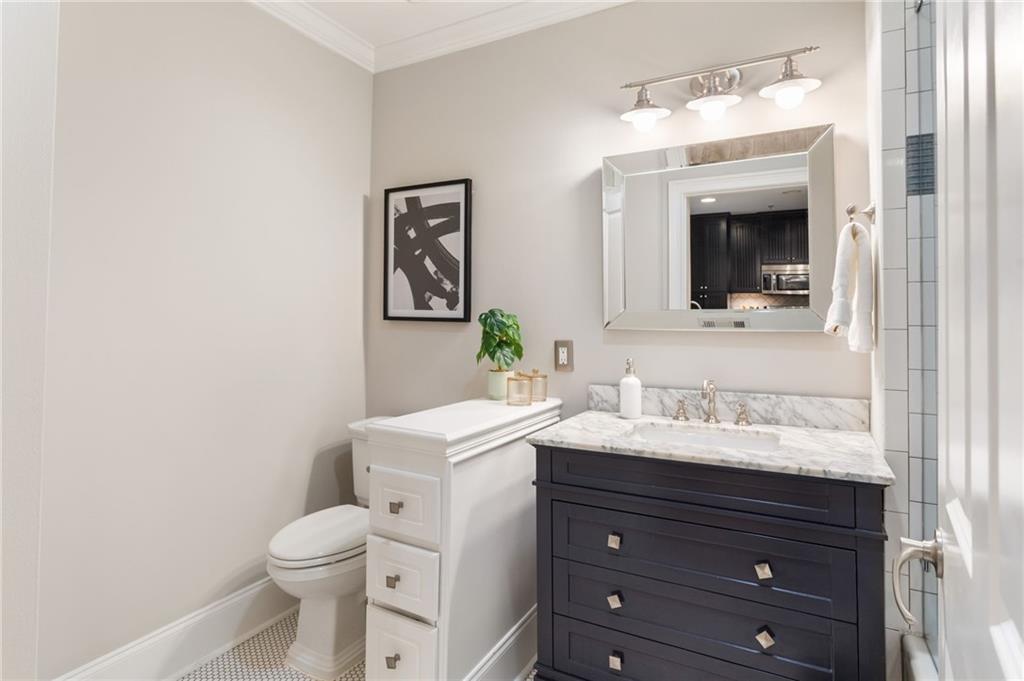 2255 Peachtree Road Northeast, Unit 326 Atlanta, GA 30309 - Photo 10 of 37 a bathroom with a sink vanity and toilet