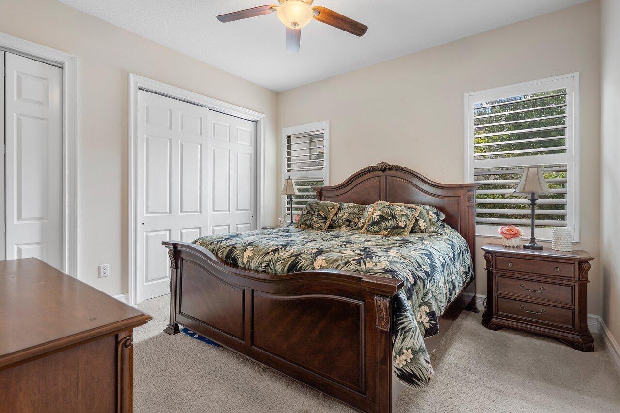 16857 Pierre Circle Delray Beach, FL 33446 - Photo 21 of 57 a bedroom with a bed and a dresser