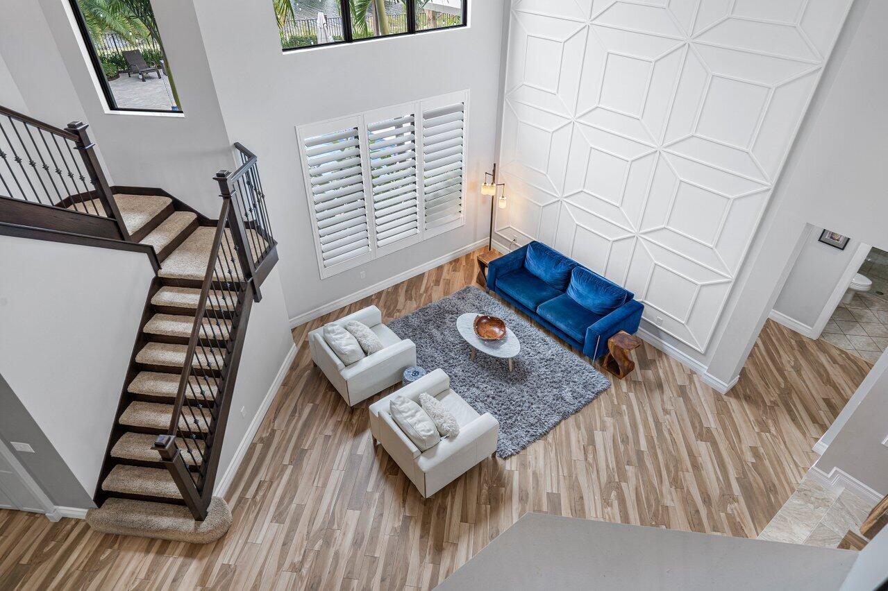 16857 Pierre Circle Delray Beach, FL 33446 - Photo 23 of 57 a living room with furniture and wooden floor