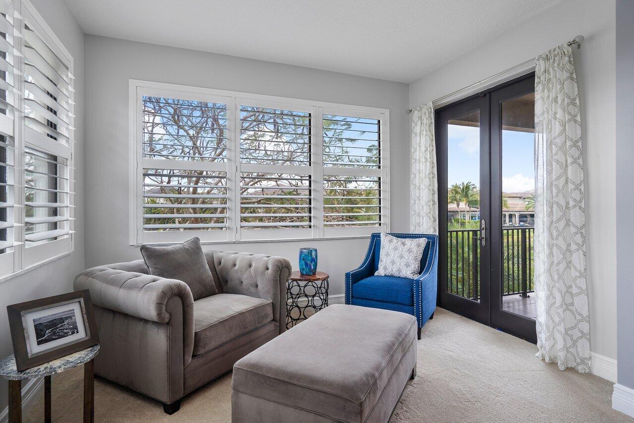 16857 Pierre Circle Delray Beach, FL 33446 - Photo 25 of 57 a living room with furniture and a large window