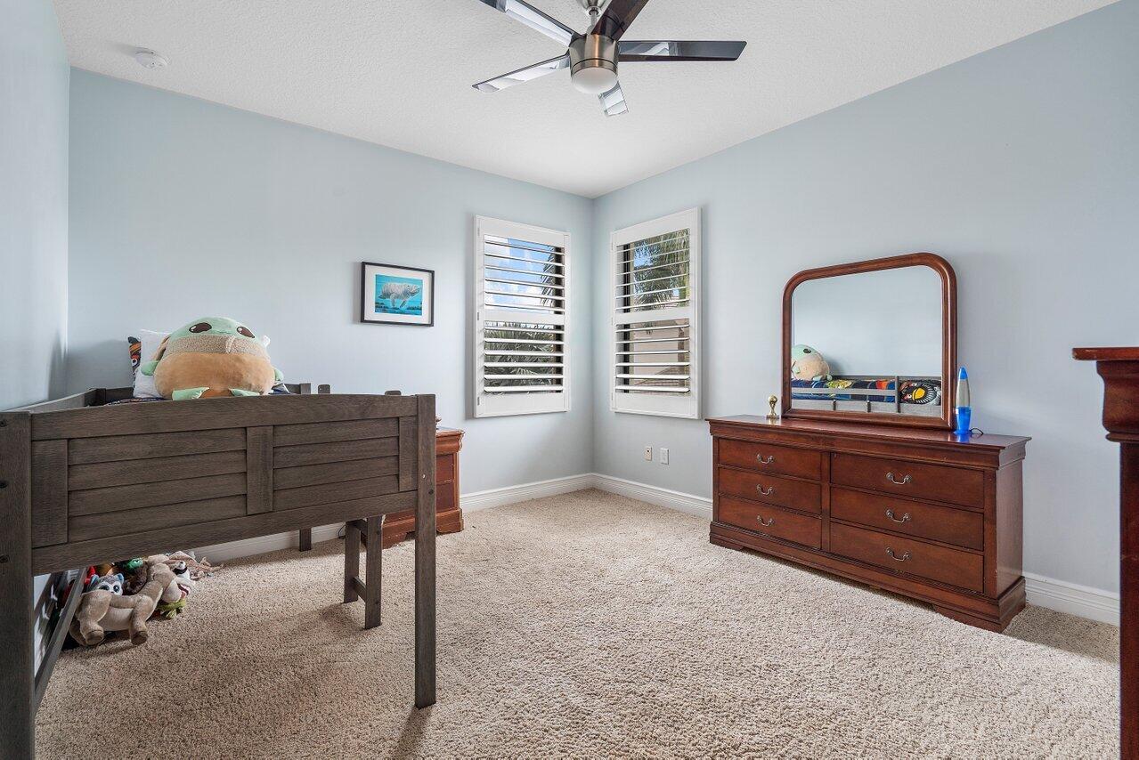16857 Pierre Circle Delray Beach, FL 33446 - Photo 30 of 57 a room with a dresser and a window