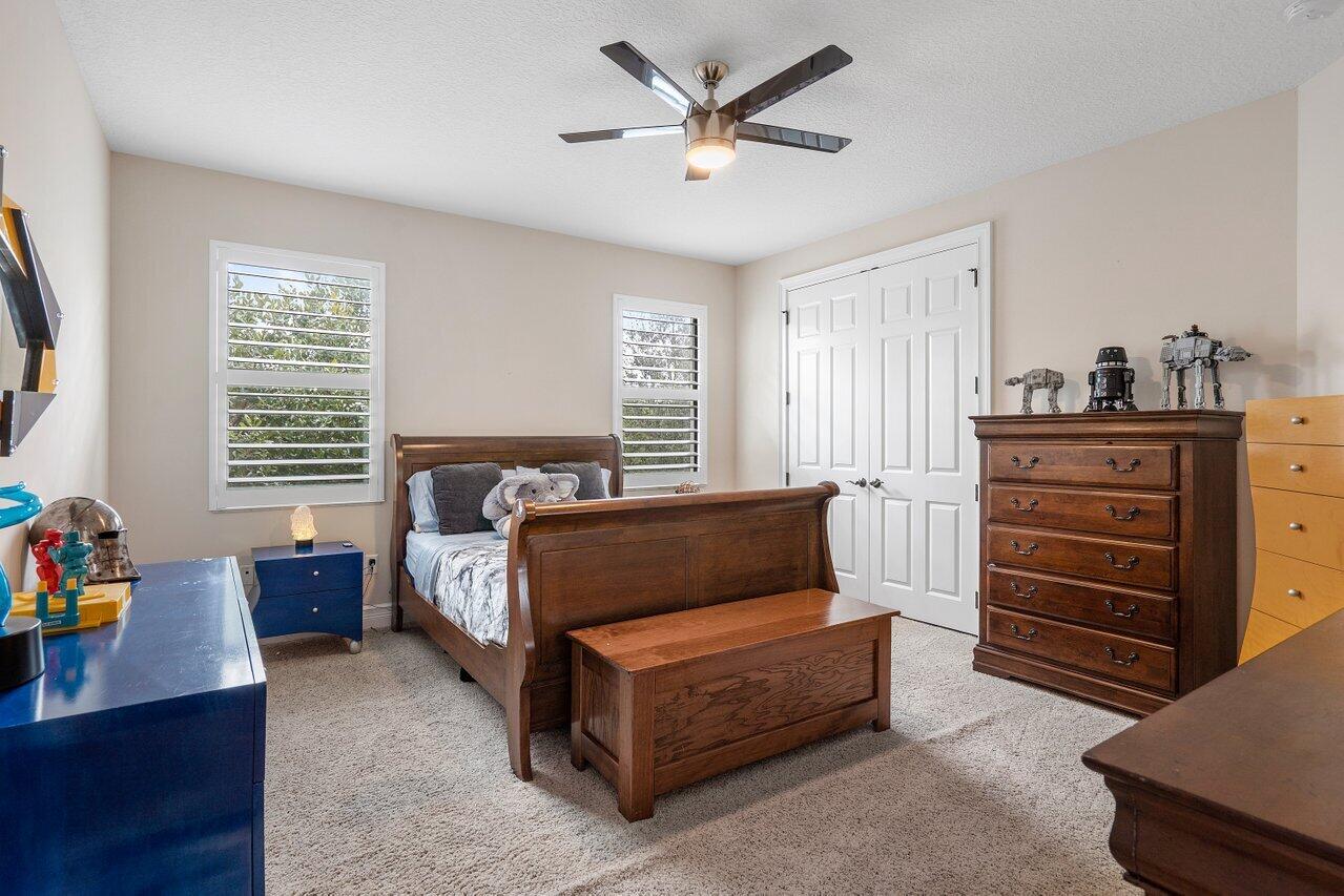 16857 Pierre Circle Delray Beach, FL 33446 - Photo 34 of 57 a spacious bedroom with a bed and a window