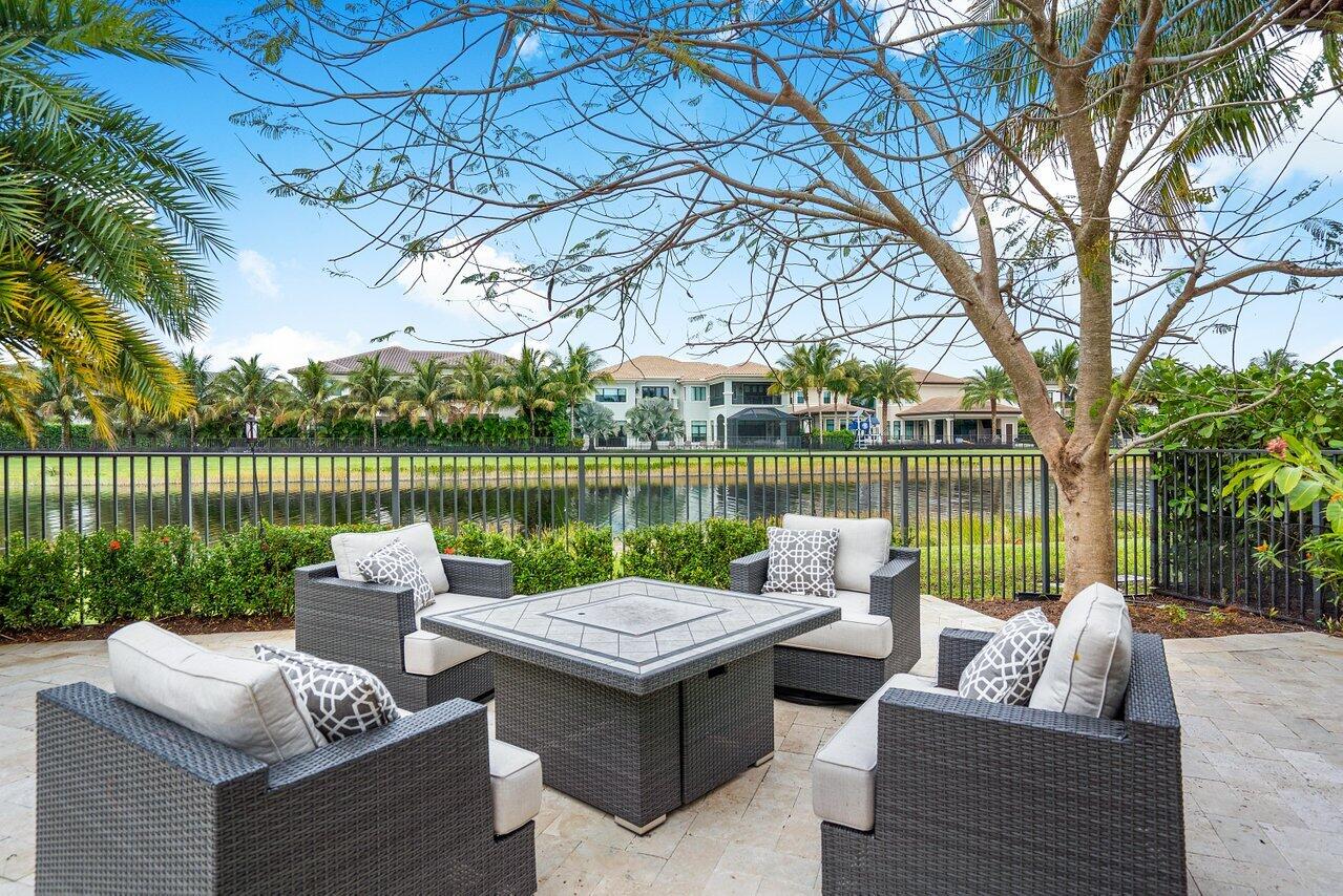 16857 Pierre Circle Delray Beach, FL 33446 - Photo 40 of 57 a view of a lake with couches in a patio