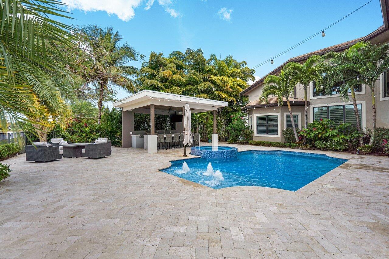 16857 Pierre Circle Delray Beach, FL 33446 - Photo 43 of 57 a view of a house with swimming pool and sitting area