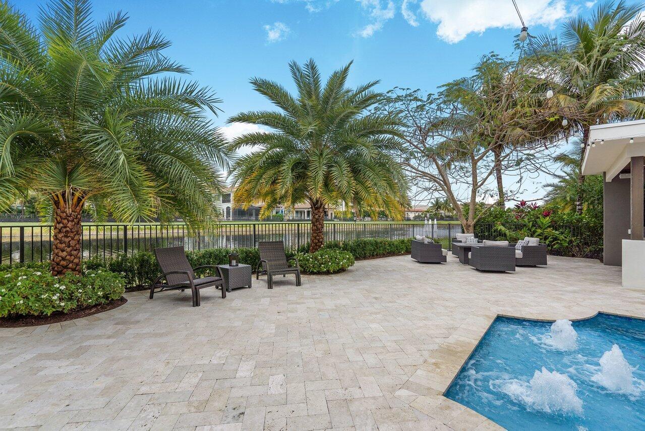 16857 Pierre Circle Delray Beach, FL 33446 - Photo 45 of 57 a view of a backyard with a patio and plants