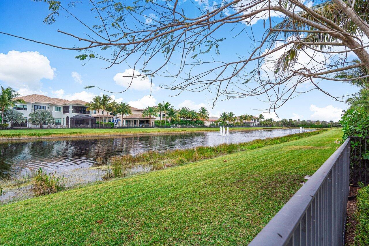 16857 Pierre Circle Delray Beach, FL 33446 - Photo 46 of 57 a view of a lake with a yard and large trees
