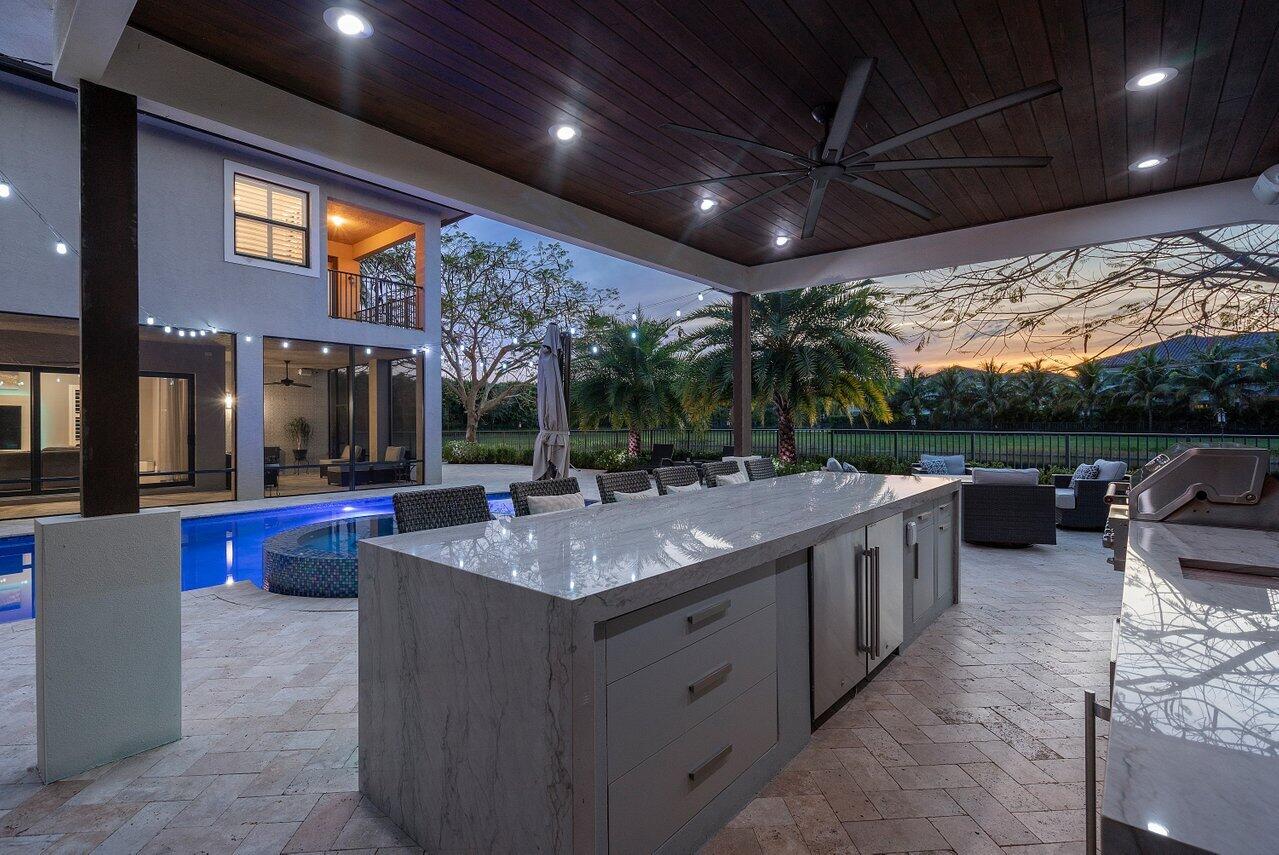 16857 Pierre Circle Delray Beach, FL 33446 - Photo 53 of 57 a view of a patio with chairs and a grill