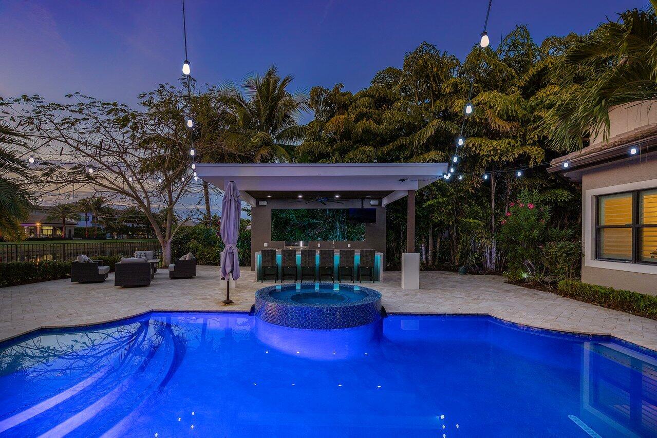 16857 Pierre Circle Delray Beach, FL 33446 - Photo 55 of 57 a view of a house with swimming pool and sitting area