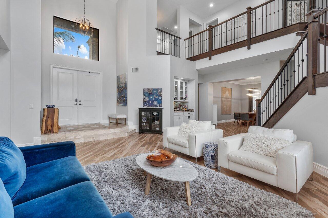 16857 Pierre Circle Delray Beach, FL 33446 - Photo 7 of 57 a living room with furniture and a fireplace